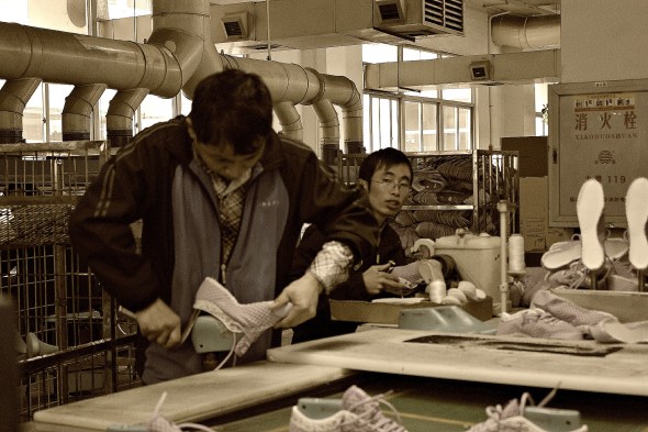 Molding a hot shoe to a foot-shape.