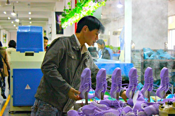Heating up shoes in Anta Shoe factory in Fujian, China